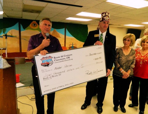 Route 66 Cruisers club member present the check to Akdar Shrine. (L to R): Dwayne Caldwell, club president; Thomas Morgan Bear, Akdar Shrine; Sharon Caldwell; Sharon Coldren and Denny Coldren.