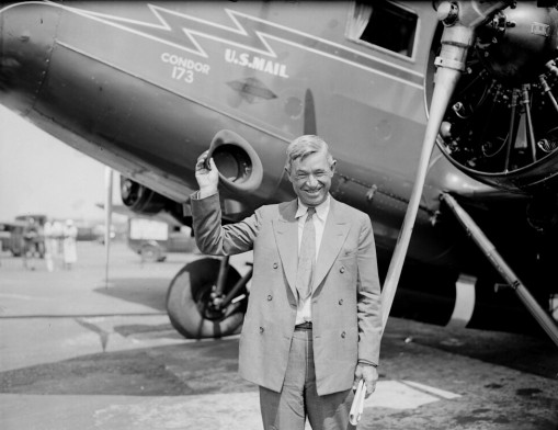 Will Rogers doffs his hat at the East Boston Airport during one of his numerous visits to local airports during his lifetime. Rogers was an early supporter and advocate of the then-budding aviation industry.