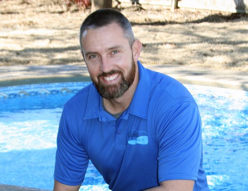 Custom Pools inc. Co-Owner Josh Atkinson shown on site at a recently completed vinyl pool project.  Custom Pools 
specializes in swimming pools from basic to extravagant.