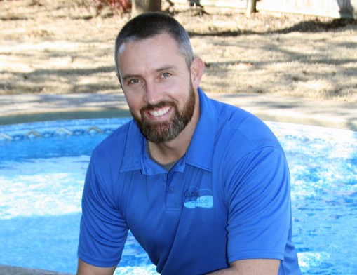 Custom Pools inc. Co-Owner Josh Atkinson shown on site at a recently completed vinyl pool project.  Custom Pools 
specializes in swimming pools from basic to extravagant.