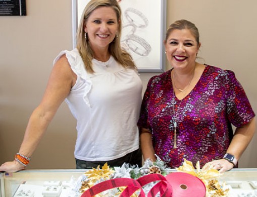 Events Manager, Amber Hinkle (left), and Communications and Marketing Manager, Lindsay Cunningham (right), encourage anyone and everyone to shop in Broken Arrow during this holiday season to support local small businesses and maybe win big!