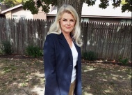 Kim Koleber stands in the backyard of her event center, where she has been advocating during the pandemic.