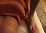 Manda Reyes performs Ashiatsu, a barefoot massage technique.