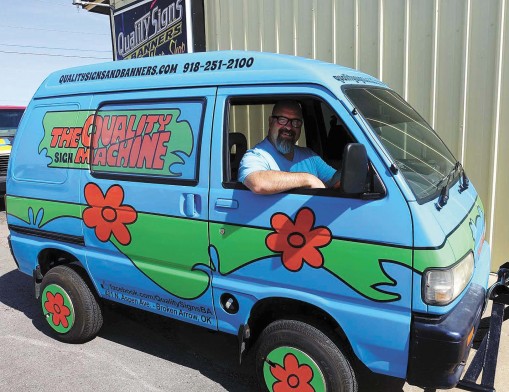 Quality Signs & Banners Owner Rodney Brown delights in watching smiles spread across the faces of kids and adults alike whenever they see The Quality Sign Machine.