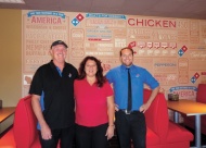 Dale and Rosie Wills, Domino’s franchise owners, with their son and store manager Josh.