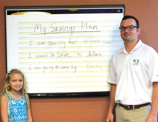 Saving money starts with a plan. Ray Simmons with daughter Kaitlyn.