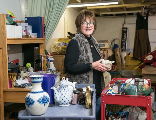 Thrift Harbor employee separating the donations.