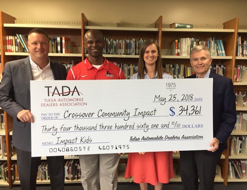 TADA donated $34,000 to CCI IMPACT Kids. Left to right TADA member Tom Bloomfied, CCI Executive Director Philip Abode, Leah Pickard, and TADA member Greg Kach.