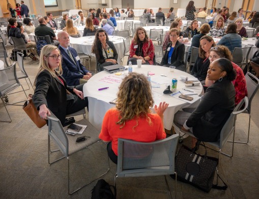 A group of higher education staff and faculty from THE Consortium institutions share ideas for supporting students who transfer from TCC to other institutions within the Consortium. The conversation was led by Kelsey Dowdell (University of Tulsa).  Photo Credit: University of Tulsa
