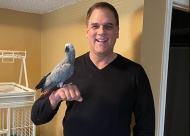 Jeff Wetterman with his Congo African Grey Parrot, Gracie.