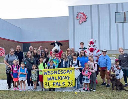 Volunteers for Youth staff joined by community members celebrate National Walk & Bike to School Day October 6th.