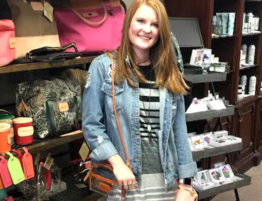 Sales Associate Kayla Dossett displays the latest bags from John Hart.