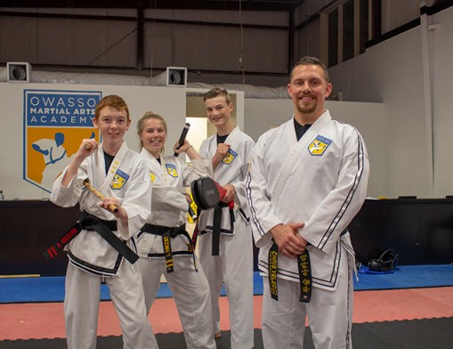 (L to R) Instructors Ramsey Hinshaw, Lexi Vincent, and Nick Welscher with Chris Velez, owner of Martial Arts Academy.