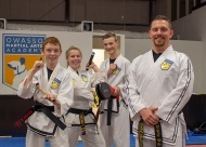 (L to R) Instructors Ramsey Hinshaw, Lexi Vincent, and Nick Welscher with Chris Velez, owner of Martial Arts Academy.