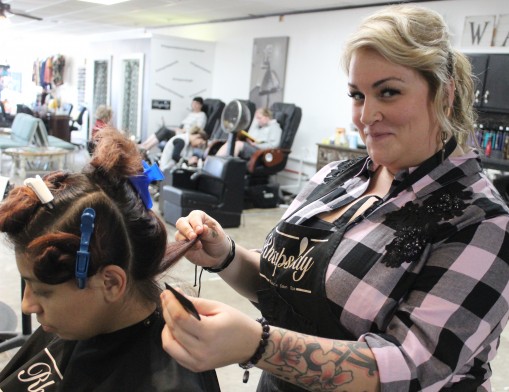 Rhapsody beautician Sheridan Long helps a customer achieve her ideal look for an upcoming event.