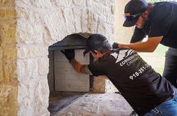 Cornerstone Chimneys installing new panels to an outdoor fireplace.
VN Value News Magazine & Values, Inc. photos, October 2025.