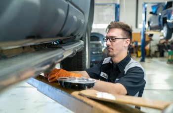 Service technician Steven performs a tire rotation.