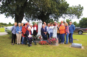 The Will Rogers Memorial Museum Ropers at the Clem and Mary Rogers gravesite in Chelsea on a field trip. In keeping with learning the family history, they have started a tradition of decorating the Chelsea grave as well as the Will Rogers family tomb on the Museum grounds.