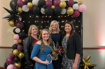 Leading of the Year Jody Reiss of Safenet Services (front) with presenters Paula Reed, Sara Edwards, and Megan Edwards of Northeast Tech.