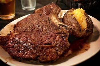 Doe’s Eat Place features a hearty collection of entrees including succulent steaks and baked potatoes.