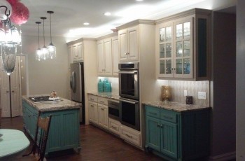 Use color on the kitchen island to brighten up the space.