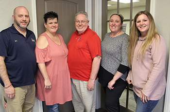 Agents at Solid Rock Realtors offer clients customized flexibility to help market their home in the way which best suits them. Among the agents working in the Claremore office are Bill Resh (from left), Kim Washburn, Trainer Mike Washburn, Shae Pearson, and Amy Cookson.