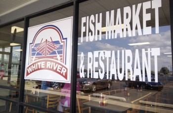 Counters of fresh fish line the store on one side, replete with vast offerings: a large, white halibut next to heaps of thick orange roughy, tilapia, frog legs, mahi mahi, sea bass, peeled and deveined shrimp, and the like.