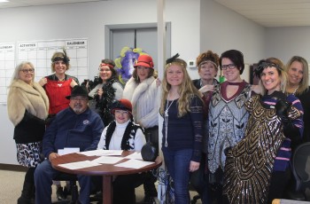 Getting into the spirit of the 20s-themed Volunteers for Youth “Chair-ity” Auction is the planning committee including (seated) Gus and Sue Ramirez; (standing left to right) Amy Graham, Alyson Short, Amber Brassfield, Celina Davis, Jody Reiss, Susan Jensen, Erica Sanders, Caitlin Turpel and Dawn Holland.