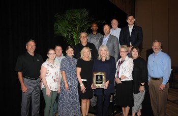 The Oklahoma Bankers Association recognized Kelley Rash’s outstanding 50-year banking career. At front, left to right: Topper Causby, Donna Malaguti, Gary King, Jamie Wheeler, LaTonya Cundiff, Kelley Rash, Nema Dobbins, Kelli Sowell, Jody Manning. Back row: Javier Gamarra, Ben Dejene, Ted Cundiff, Randy Waldrup, and Cooper Rash.