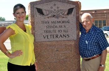 Frank Riesinger, WW II Vet and Organizer and Jamie Wheeler, AVB Bank, Assistant Vice President, with a monument to Veterans at the BA Military History Center.