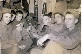 Thanksgiving Week, 1951; Soldiers of Company C, 180th Infantry Regimental Combat Team, pictured in close quarters onboard the USS Henrico, en route from Japan to Korea.  Master Sergeant Clarence G. Oliver, Jr. is at far left in the photo.  Five or six days after Thanksgiving Day, these soldiers were in combat in North Korea.