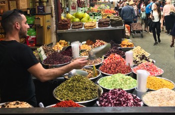An assortment of traditional Israeli spices on display for sale at a market.