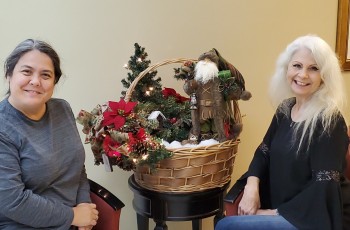 From left Ruby Quinn, Robson Performing Art Center Executive Director and
Event Coordinator Ebony Jones show off a hand crafted featured auction item.