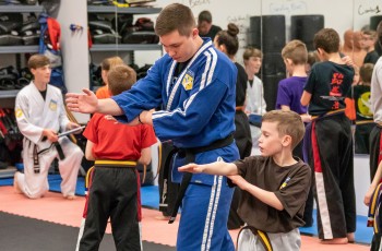 Instructor Cirilo teaches students proper form and technique.