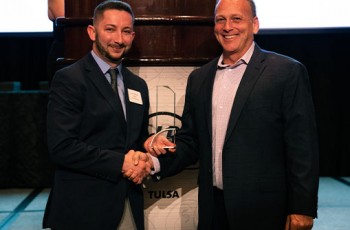 Assistant City Manager Eddie Faulkner received the Citizen of the Year Award from David McAfee.