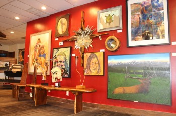 Gallery showcase wall featuring artwork by Ronnie Morris, Cherokee