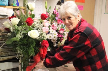 Dorothy’s employee Judy Prather readies a floral delivery for a regular customer.