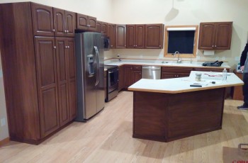 Now, these cabinets have been transformed into a modern and customized kitchen for the homeowners after Gleam Guard's refinishing services were completed.