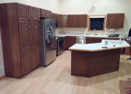 Now, these cabinets have been transformed into a modern and customized kitchen for the homeowners after Gleam Guard\'s refinishing services were completed.
