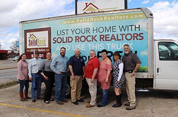 The rock solid team at Solid Rock Realtors in Claremore includes Amy Cookson (from left), Brad Mohon, Shae Pearson, owner/realtor Michael Urie, Bill Resh, Mike Washburn, Kim Washburn, Jeni Grissett, and Steve Lemmings.