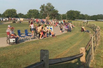 Spectators line up to watch planes arriving at the Will Rogers/Wiley Post Fly-In in Oologah.