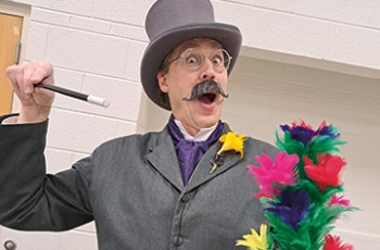 Free photo with SIR GODFREY (The Magician) Saturday, Mar 28, 11 am to 2 pm. Photo courtesy of G & T International, March 2026.