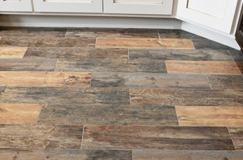 Wood look tile flooring is one of the hottest trends in home remodeling today, but will add a timeless, classic look to any room.