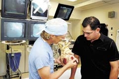 Gary Badzinski, D.O., OSUMC Cardiologist, discusses a diagnosis with a medical center patient.