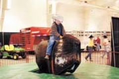 Kids always love the ­mechanical bull, including little cowboy Ace Ullrich.