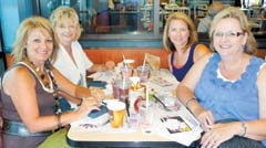 (Clockwise from left) Collinsville elementary school principals Rachel Chronister,  Janice Pollard, Julie Crutchfield and Cheryl Hunt enjoy breakfast at the Collinsville Administrators Breakfast in July, where they had the opportunity to learn about school fundraising opportunities ­offered by McDonald’s.