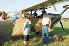 A boy and his grandfather enjoy getting an up-close look at a plane at last year’s Will Rogers-Wiley Post Fly-In.