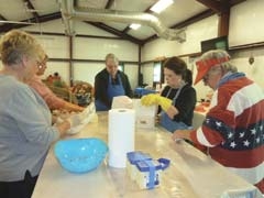 Tulsa Herb Society members work on making hypertufas for Carols and Crumpets. (Clockwise, left to right): Linda Harrison, Linda Connor, Pat Morris, Beth Teel and Linda Bevens.