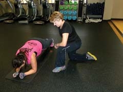 Personal trainer Lara Myers gives one-on-one instruction to Fit For Her member Jennifer Palmer.