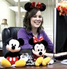 Make saving fun. Pictured: Jill Dail, of Collinsville, Mickey and Minnie Mouse.